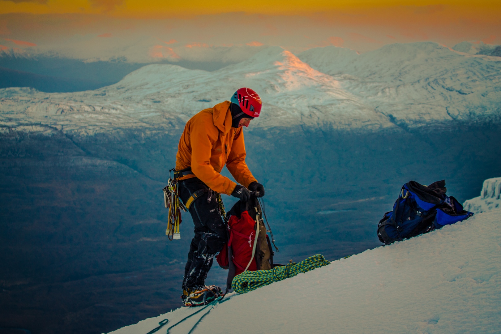 sorting gear as the sun sets at the top of Poachers Fall