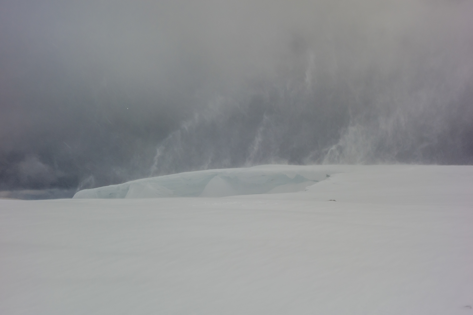 Spindrift plumes race off the top of the huge cornices - we daren't get any closer than this!