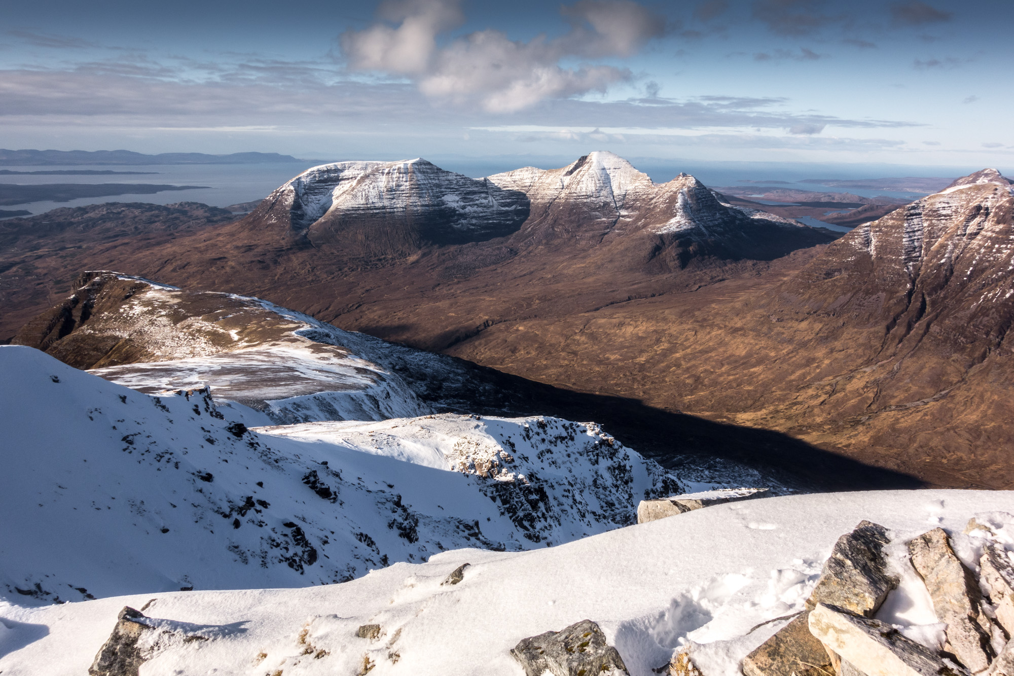 West out to Beinn Alligin, Skye and the Outer Hebrides from the summit of Mullach an Rathain