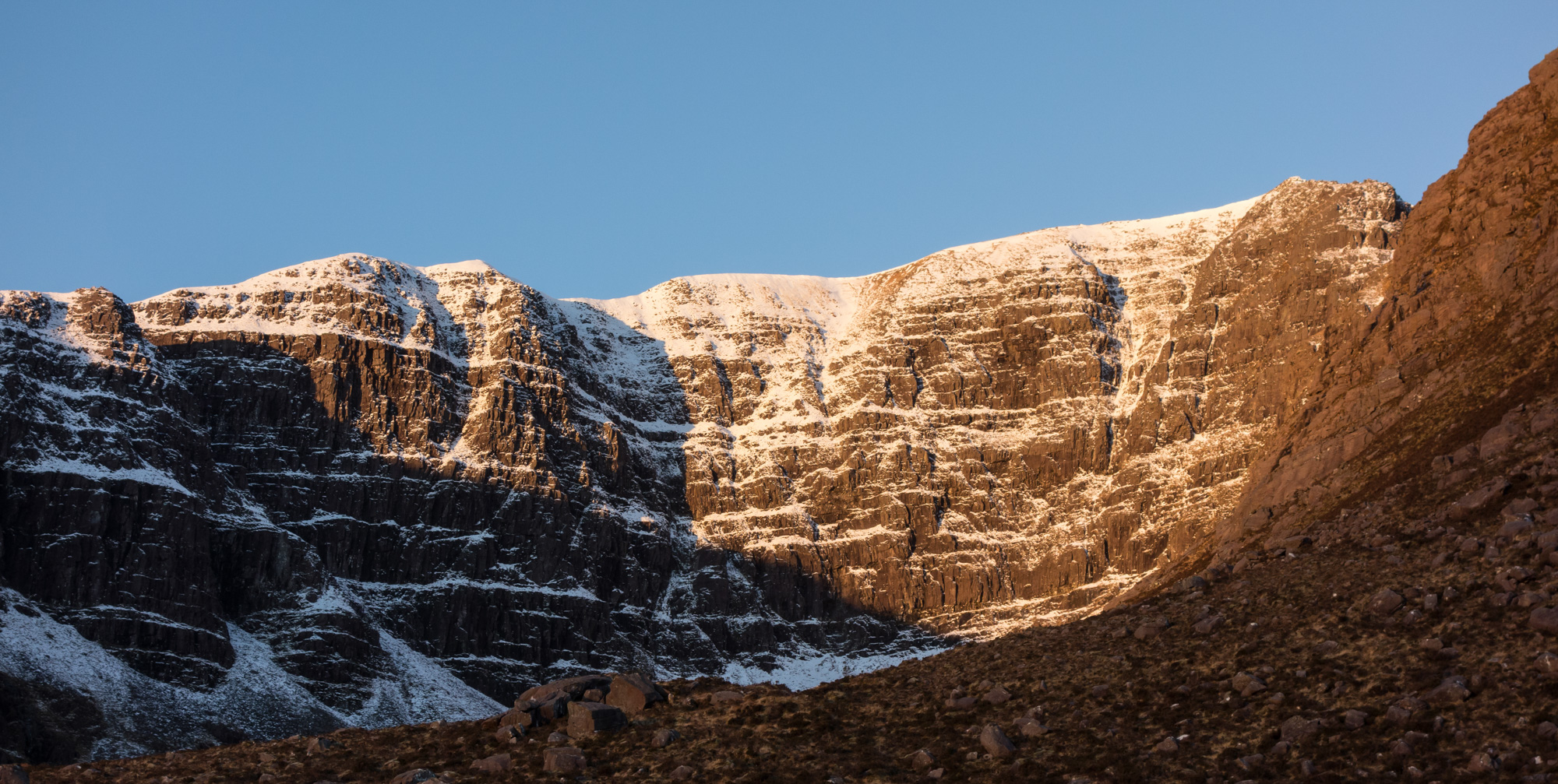 Early morning light fills Coire na Feola on the approach to A' Chioch