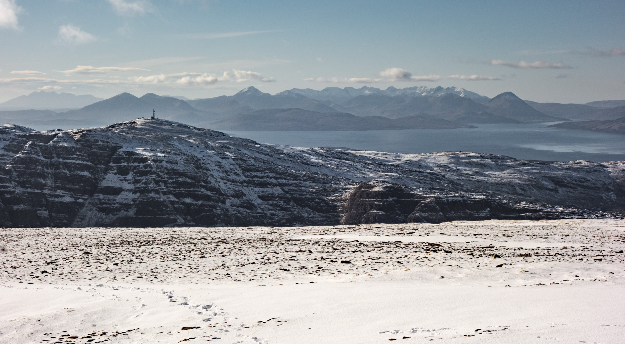 Spectacular views greeted us from the summit plateau across the Inner Sound to the Isle of Skye and a snowy Black Cuillin
