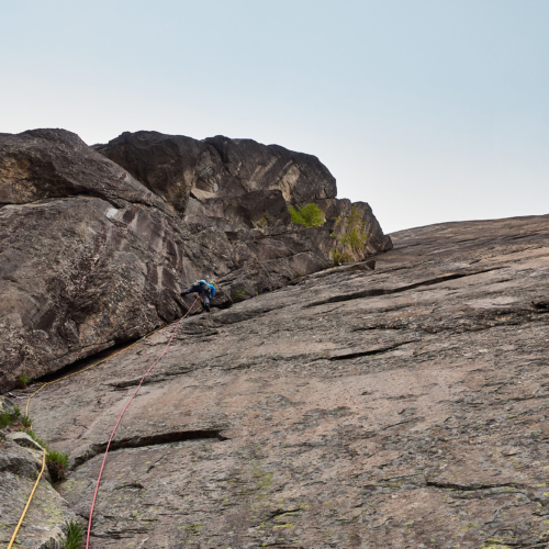 A climber on the first corner pitch of the rock climb Haegar